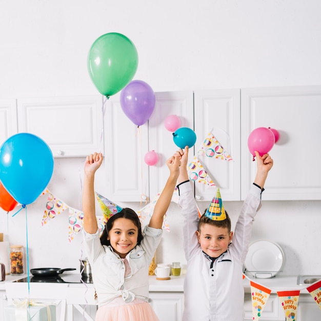 Portrait of boy and girl enjoying in the birthday party
