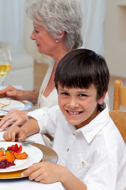 Portrait of a boy having dinner with his family