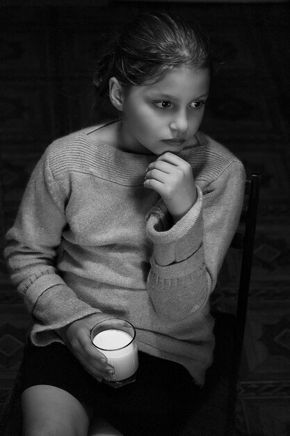 Portrait of boy holding coffee