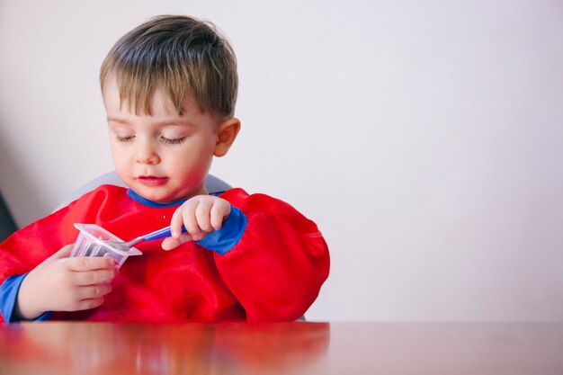 Portrait of boy holding red ball