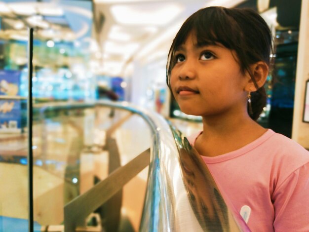 Portrait of boy looking away in store