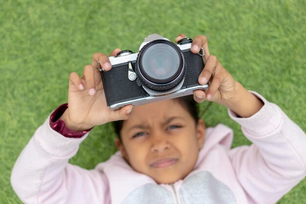 Photo portrait of boy photographing