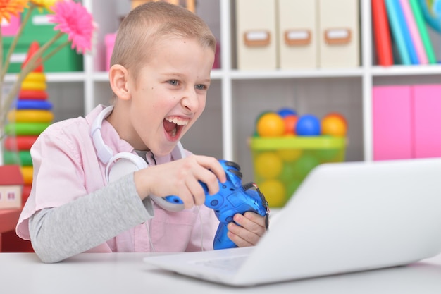 Portrait of a boy playing a computer game