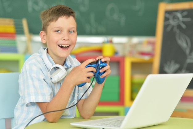 Portrait of a boy playing computer game