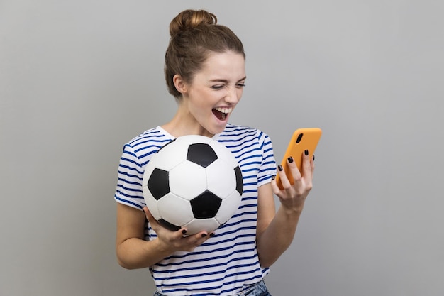 Portrait of boy playing soccer ball