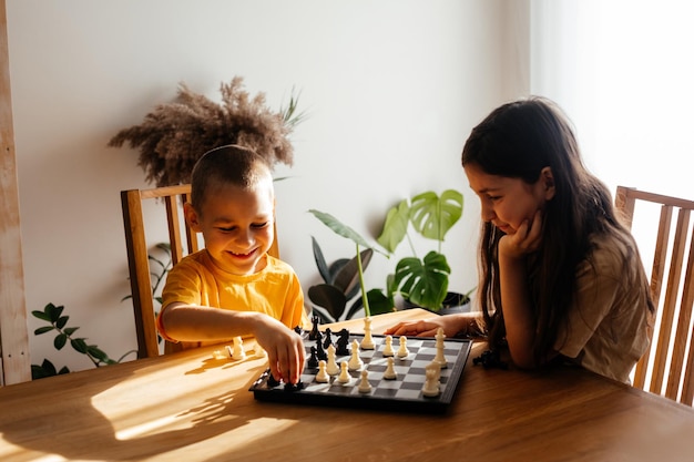 Portrait of boy playing at table