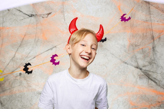 portrait boy showing funny faces for camera