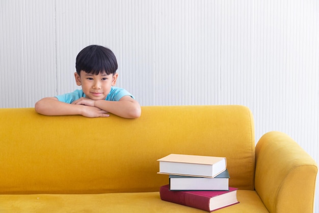 Portrait of a boy sitting on table