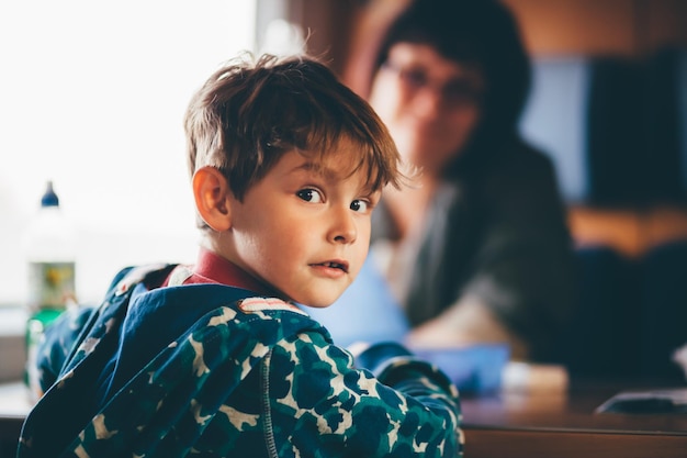 portrait of boy sitting in train
