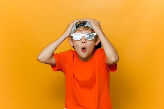 Portrait of boy standing against yellow background