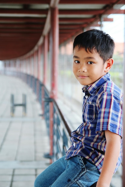 Portrait of boy standing outdoors