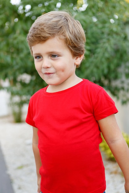 Portrait of boy standing outdoors