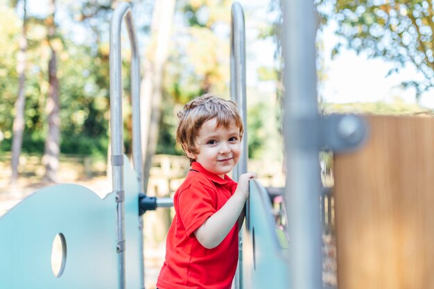 Portrait of boy standing at playground