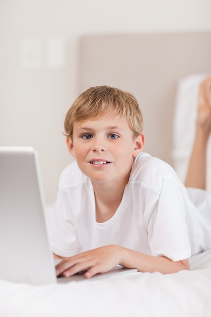 Portrait of a boy using a laptop