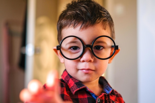 portrait of boy wearing large eyeglasses