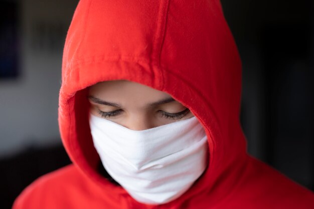 Portrait of a boy wearing a medical mask