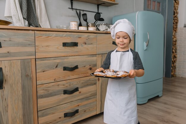 portrait boy with Christmas cookies