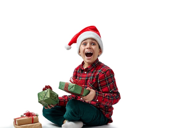 portrait boy with gifts on christmas time