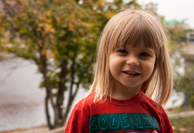 Photo portrait of boy with long blond hair