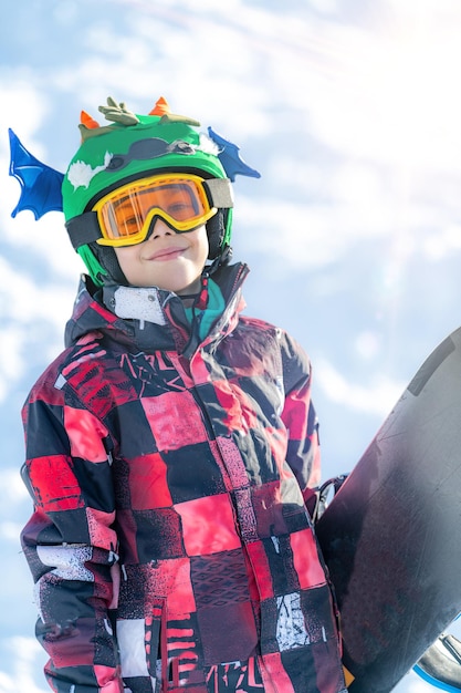 Portrait of Boy with Snowboard