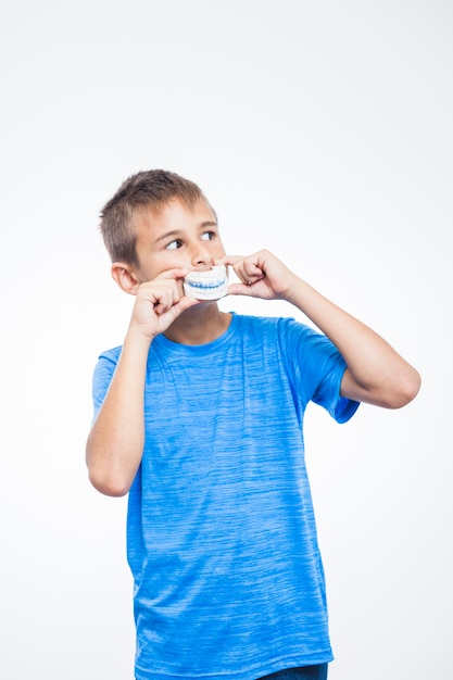 Photo portrait of a boy with teeth model