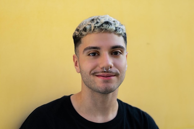 portrait of boy on yellow background