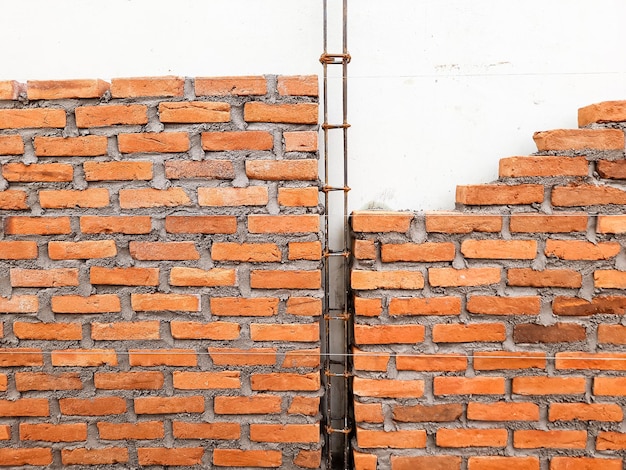 Photo portrait of the brickwork of an unfinished house construction