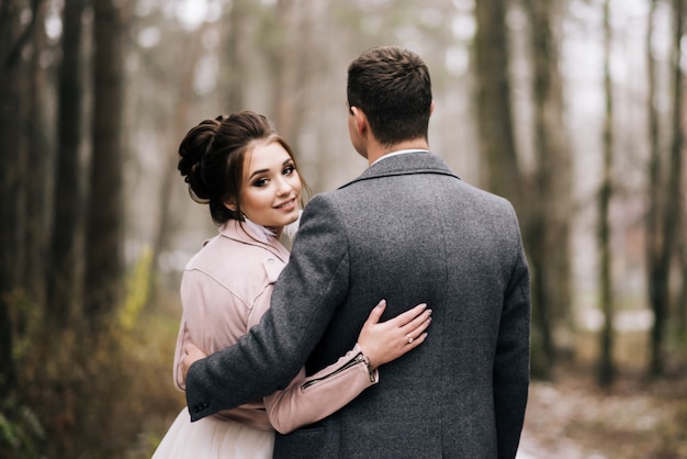 Portrait of the bride and groom in the forest