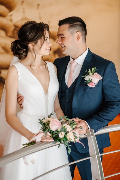 Photo portrait of the bride and groom at a photo shoot in the interior