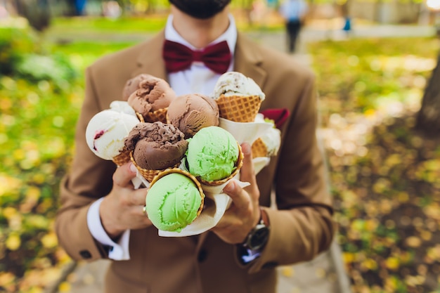 Portrait of the bride and groom with ice-cream.