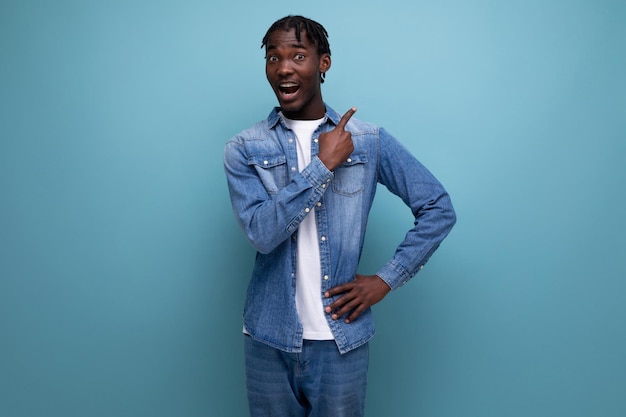 Portrait of a brunet american young man with dreadlocks with a brilliant idea