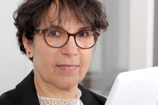 Portrait of brunette mature woman with glasses