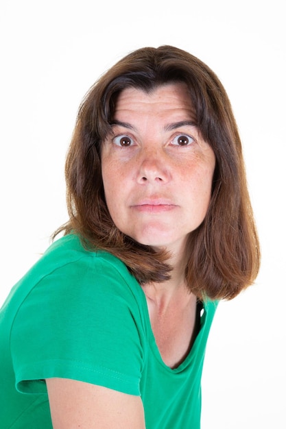 Portrait brunette woman standing in white background