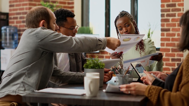 Portrait of business colleagues working at table