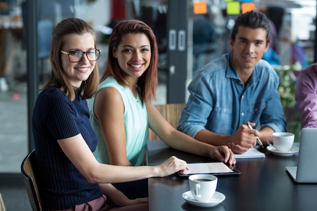 Portrait of business executives sitting in office