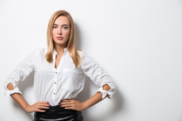 Portrait of business lady against blank wall