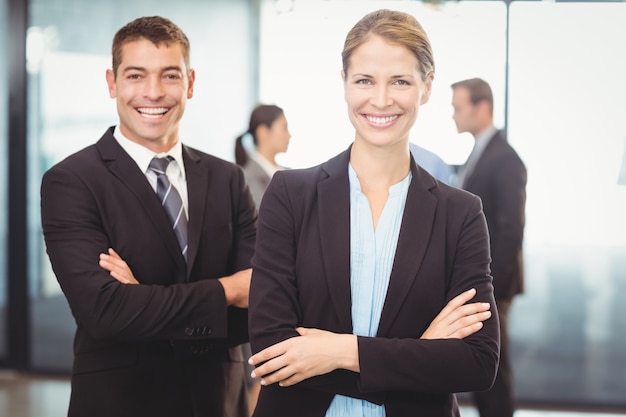 Portrait of business man and business woman smiling