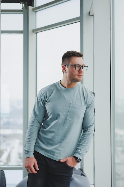 Portrait of a business man in glasses The face of a modern freelancer Businessman in casual clothes