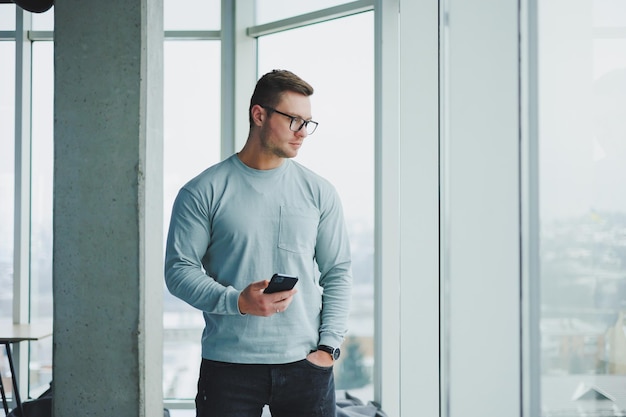 Portrait of a business man in glasses The face of a modern freelancer Businessman in casual clothes