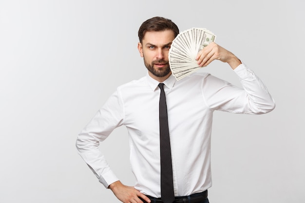 Portrait of a business man holding money, isolated on white.