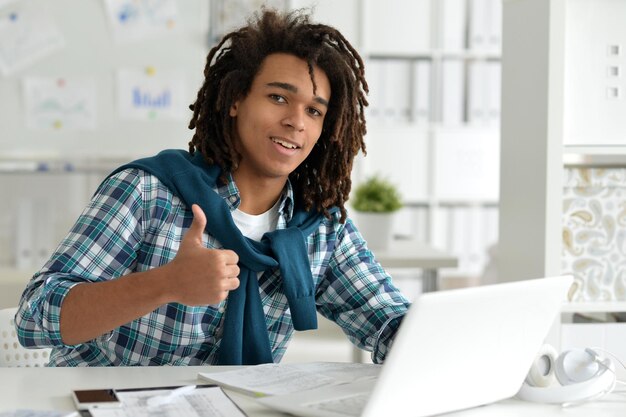 Portrait of a business man with a laptop