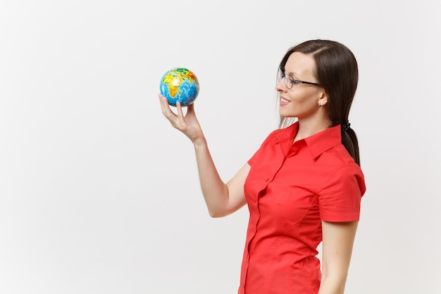 Portrait of business or teacher woman in red shirt holding in palms earth globe isolated on white background. problem of environmental pollution. stop nature garbage, environment protection concept.