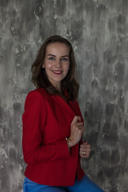 Portrait of a business woman in a red jacket