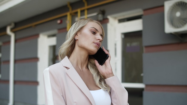 Portrait business woman talking phone at street Woman having phone talk outdoor