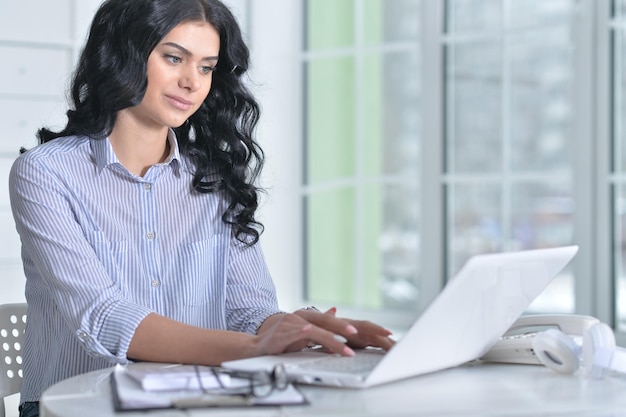 Portrait of a business woman with a laptop