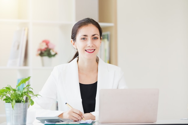 Portrait business women smiling working in office