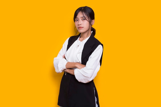 Portrait of business young asian woman isolated on yellow background