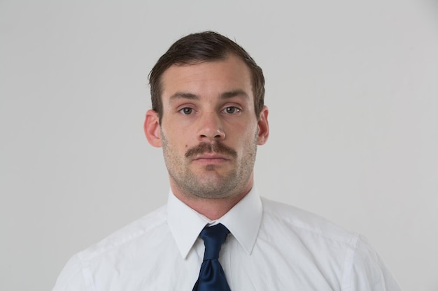 Portrait of businessman against white background