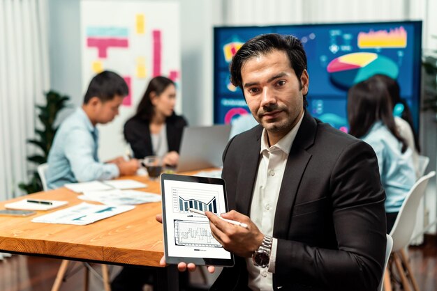 Portrait of businessman or analyst looking at camera in meeting Meticulous