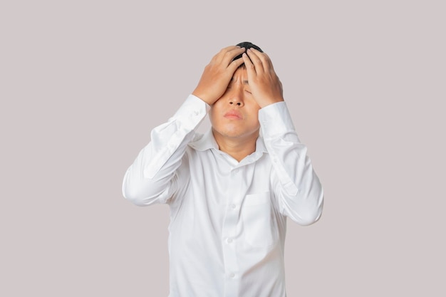 Portrait of businessman feeling disappointed unhappy and negative gesture Human emotion face expression concept Studio shot isolated on gray background copy space